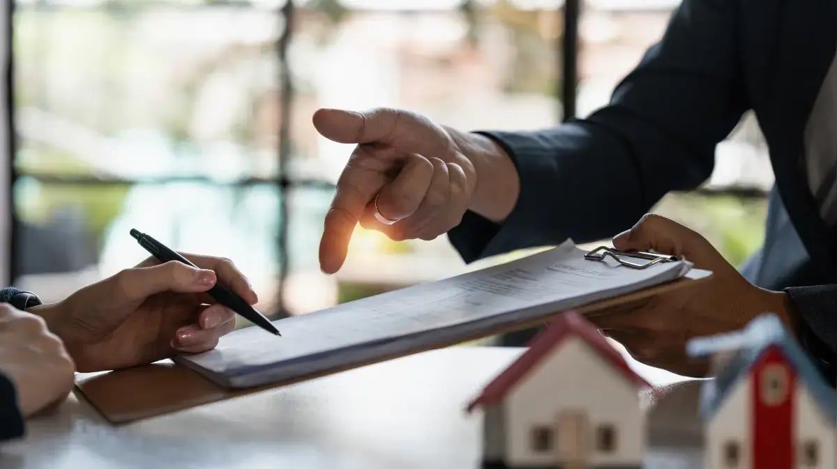 Two people making a deal with real estate