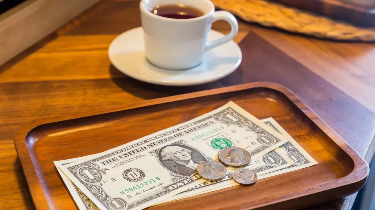 tipped money on a table for a restaurant worker